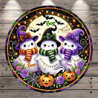 A circular Halloween-themed decoration featuring three cute, smiling ghost characters with witch hats and scarves, surrounded by pumpkins, roses, and bats against a starry night sky background.