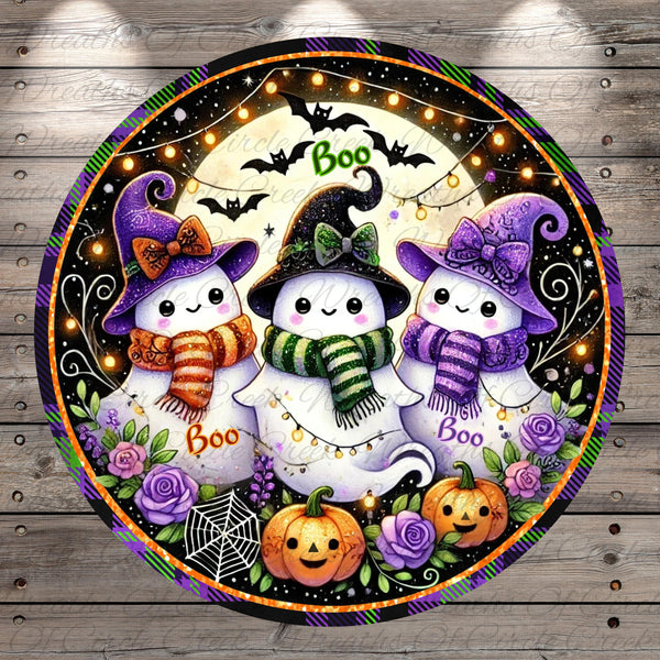 A circular Halloween-themed decoration featuring three cute, smiling ghost characters with witch hats and scarves, surrounded by pumpkins, roses, and bats against a starry night sky background.