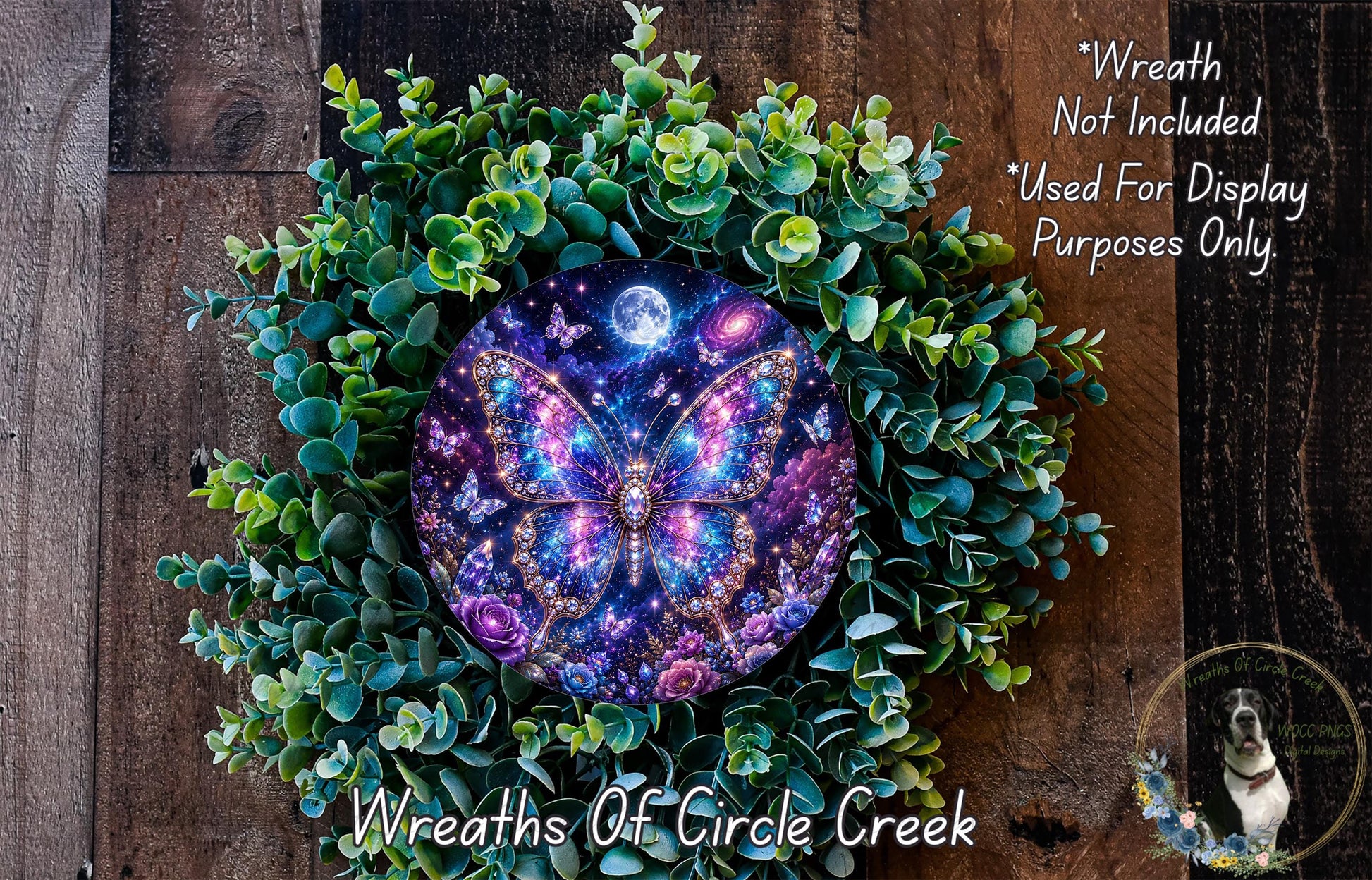 A wreath made of green leaves and flowers, with a large, colorful butterfly design in the center. The butterfly has a purple and blue pattern and appears to be floating in a starry night sky. The wreath is set against a wooden background.