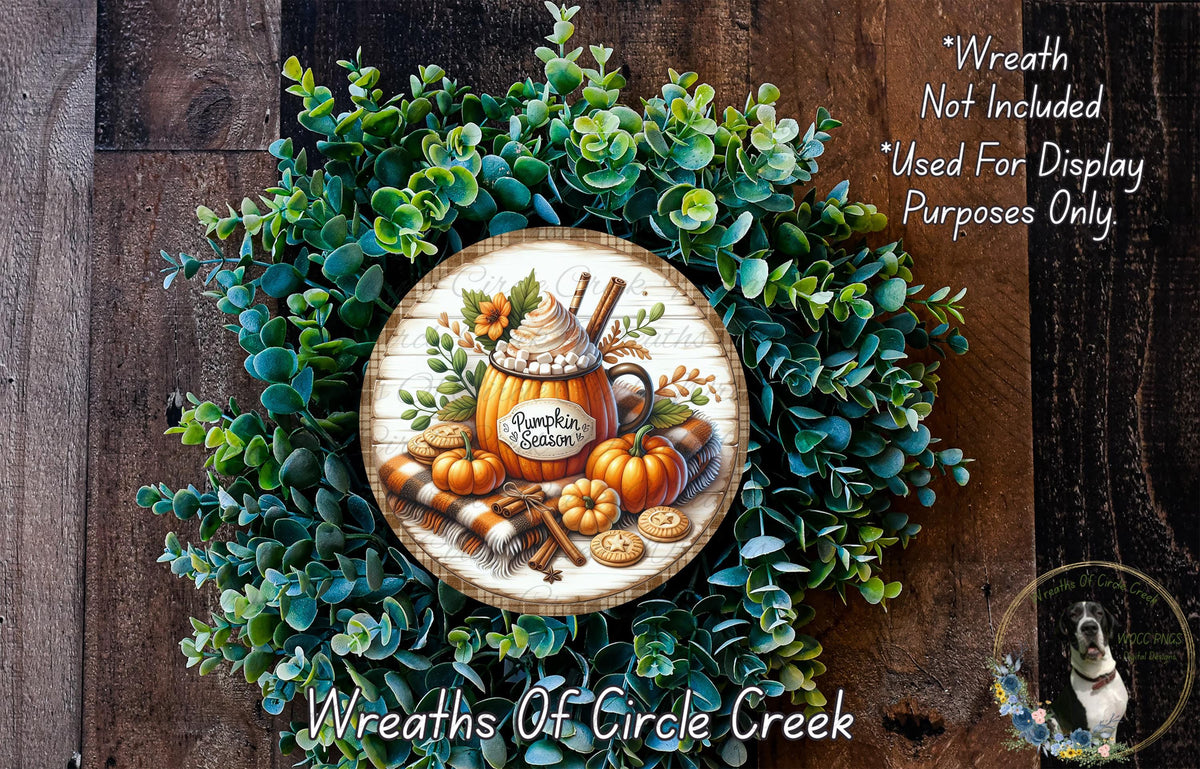 a wreath with a pumpkin and other fall-themed items, including a pumpkin-shaped mug and a pumpkin. The wreath is surrounded by a lush green plant and has a wooden frame. The text "Wreath Not Included * Used For Display Purposes Only" is displayed above the wreath, and the text "Wreaths Of Circle Creek" is written below the wreath.
