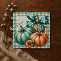 A decorative collage featuring a green and orange pumpkin with a polka dot bow, surrounded by white flowers and a beige cloth on a wooden surface.