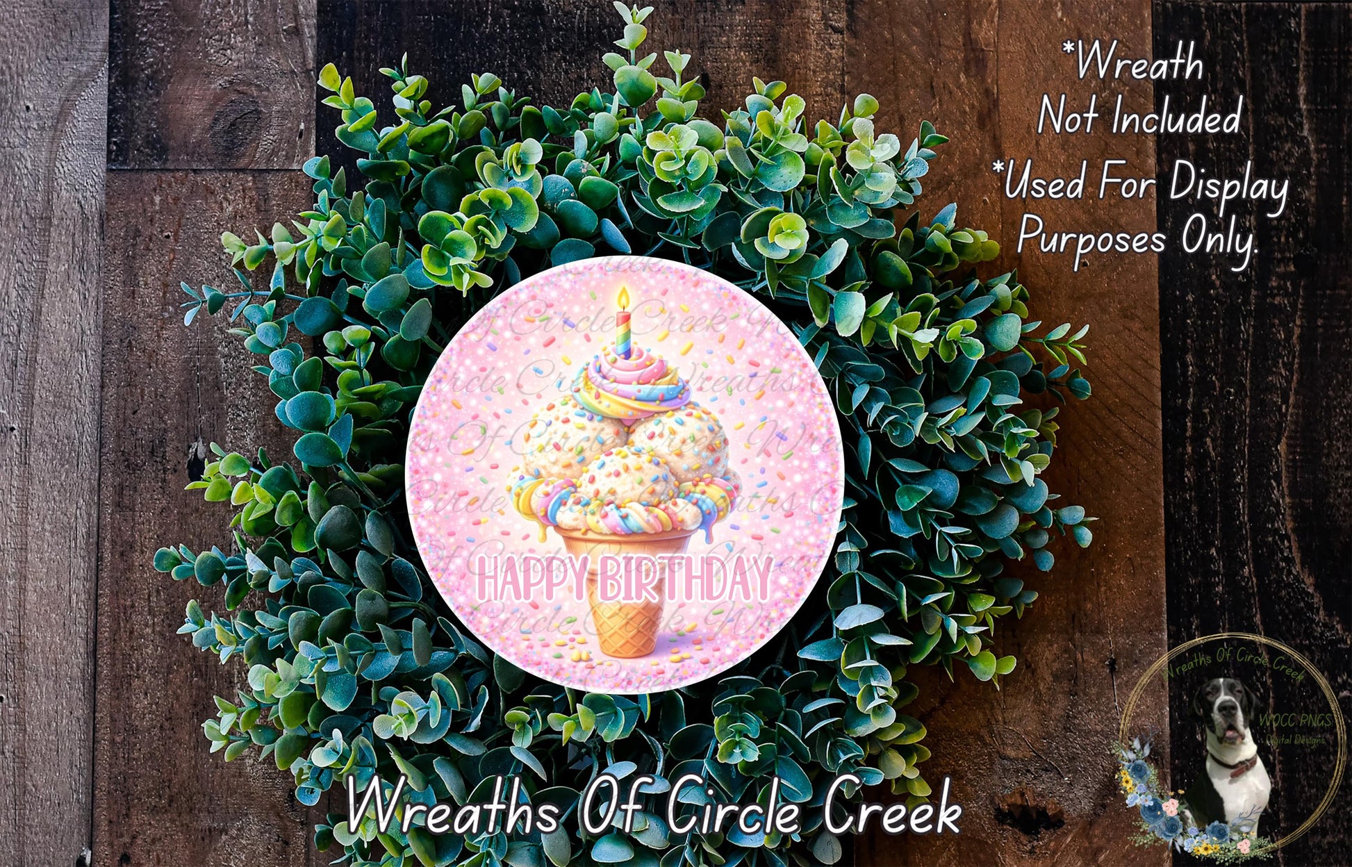 A wreath made of green leaves and a pink circular decoration with a colorful ice cream cone and the text "Happy Birthday" on it.