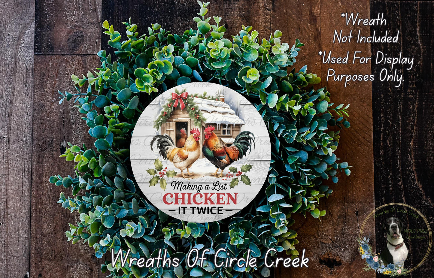 a wreath made of green foliage and a white sign with a rooster and the text "Making a List Chicken IT TWICE". The sign is surrounded by a wreath, creating a festive and decorative arrangement.