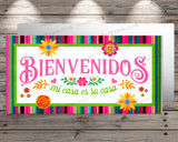 a sign that says bienvendos with flowers on it