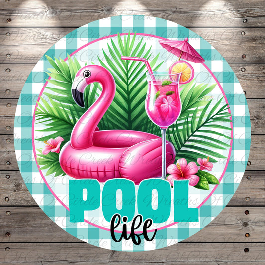 A pink flamingo floating on a green leafy plant, with a pink drink in a glass and a pink umbrella nearby, surrounded by the text "POOL life" in a stylized font.