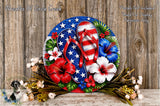 a vibrant and colorful wreath made of a circular frame with a red, white, and blue design, adorned with flowers and leaves.