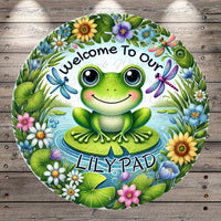 a green frog sitting on top of a lily pad