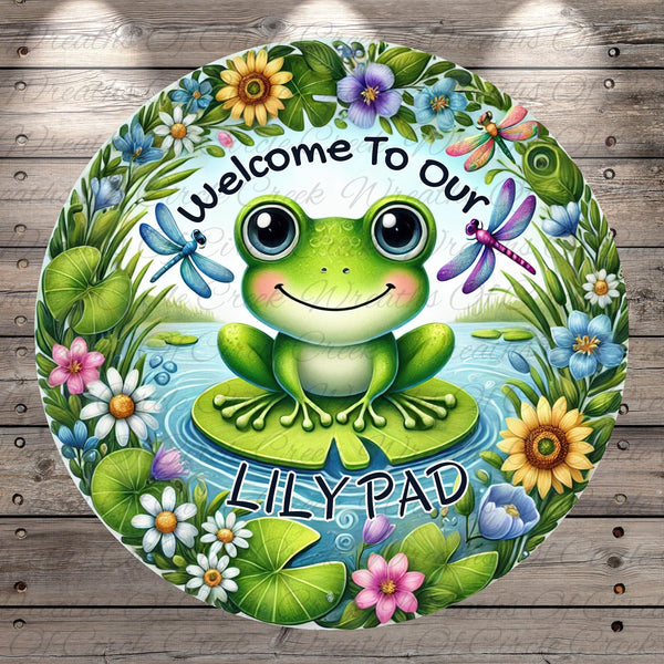 a green frog sitting on top of a lily pad
