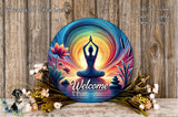 a colorful welcome sign with a yoga pose, surrounded by flowers and a wooden background.