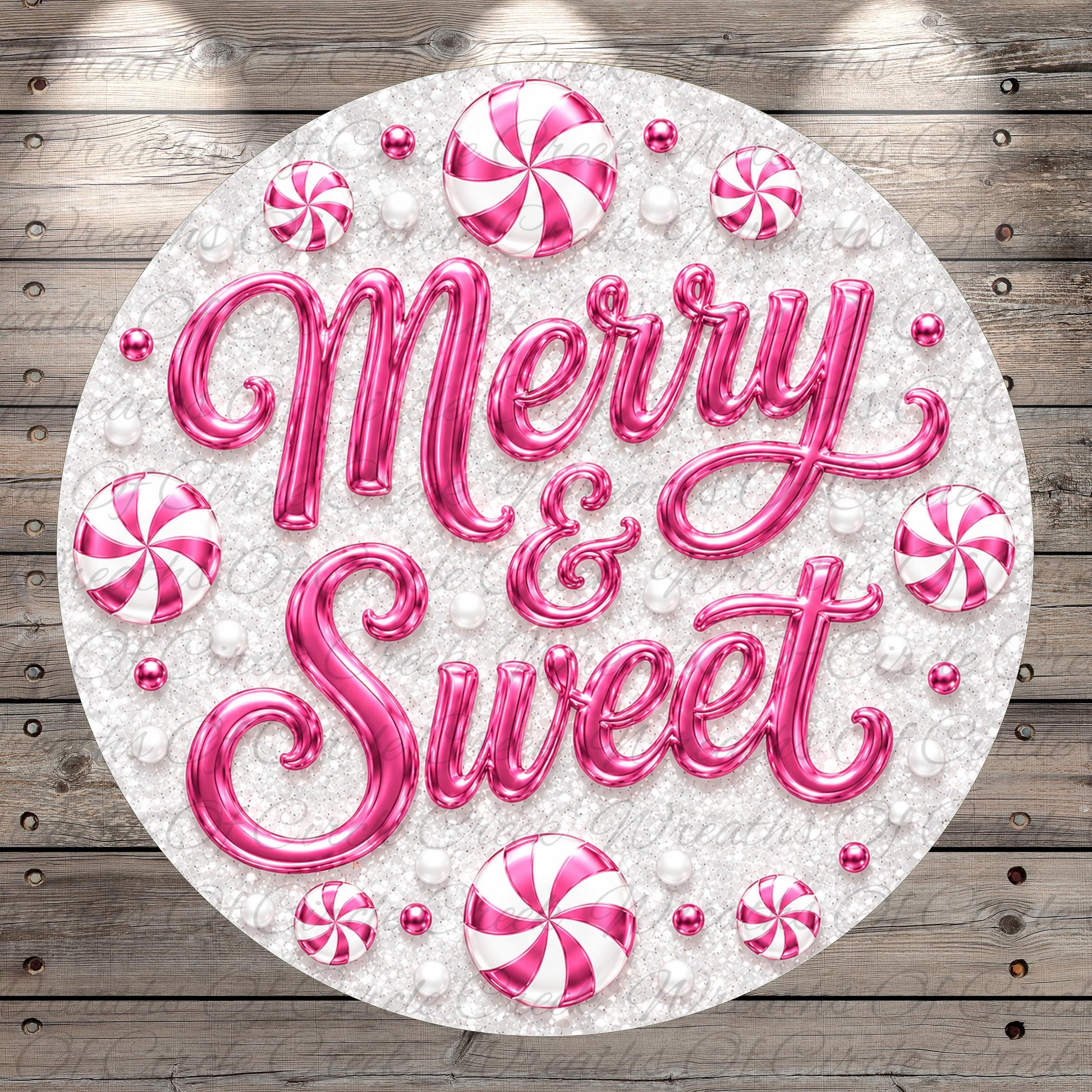 A circular arrangement of pink and white candy pieces, with the text "Merry & Sweet" prominently displayed in the center.