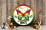 a circular sign with a colorful butterfly design, surrounded by flowers and placed on a wooden surface.
