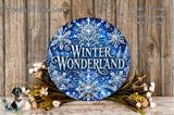 A circular wreath with the text "Winter Wonderland" in a blue and white color scheme, surrounded by flowers and placed on a wooden surface.