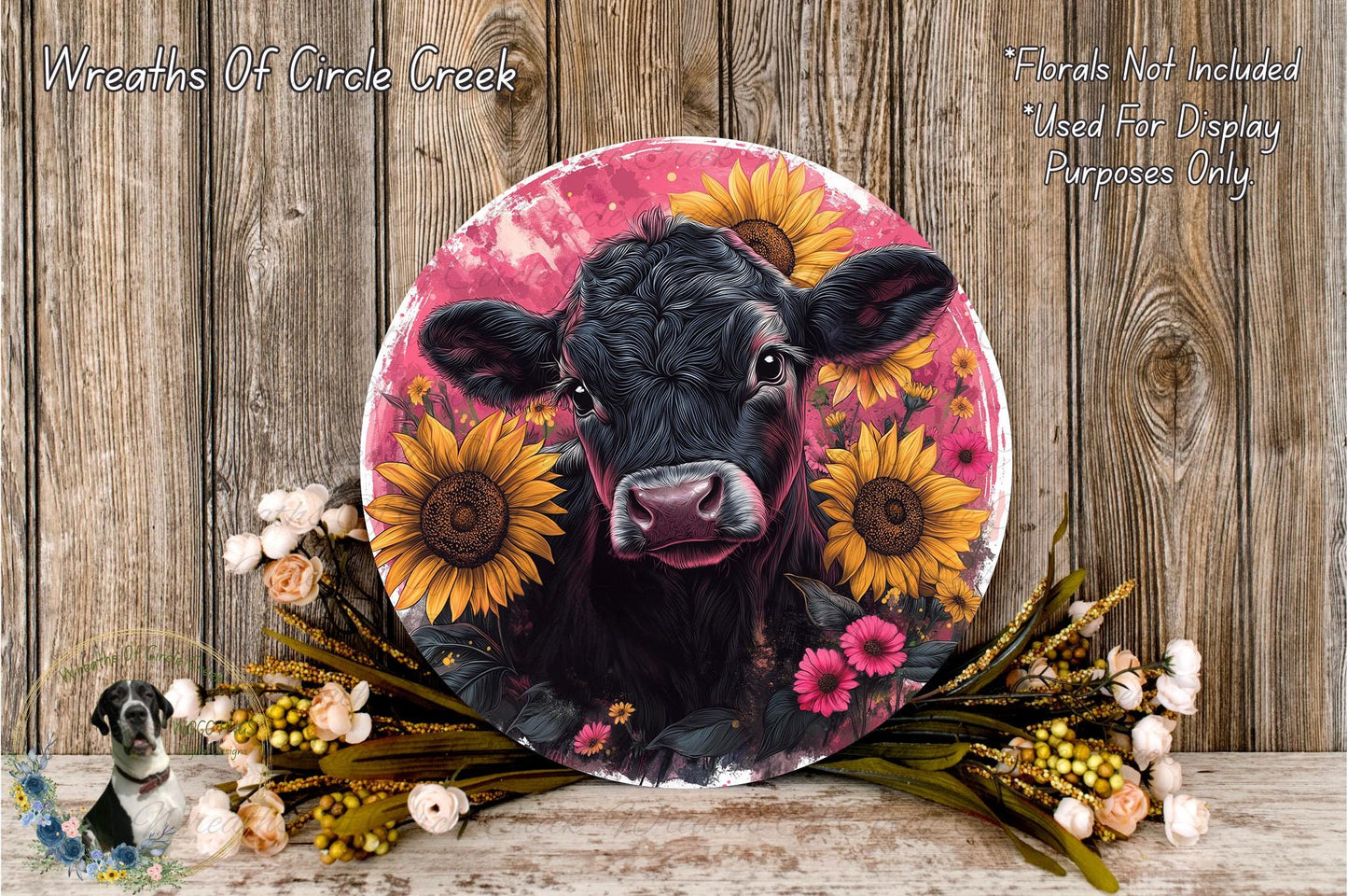 a picture of a cow with sunflowers on it