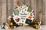 a teacher lives here sign on a wooden background
