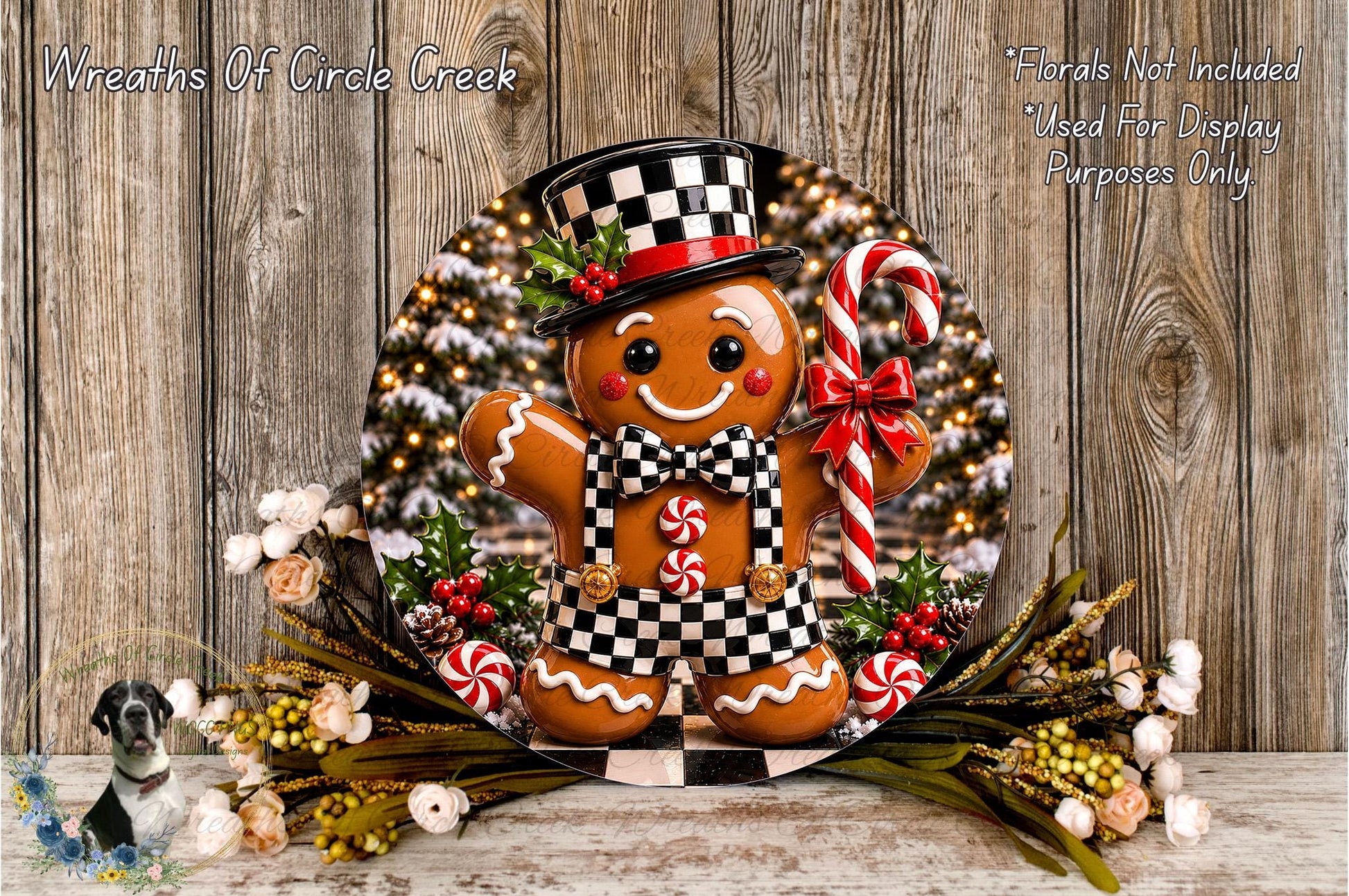 A gingerbread man figure wearing a top hat and bowtie, surrounded by a wreath of flowers and a candy cane, against a backdrop of a Christmas tree.