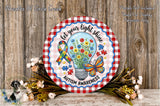 a round sign with a floral design and a light bulb inside, surrounded by flowers and a butterfly. The sign has the text "Let your light shine" and "Autism Awareness" written on it.