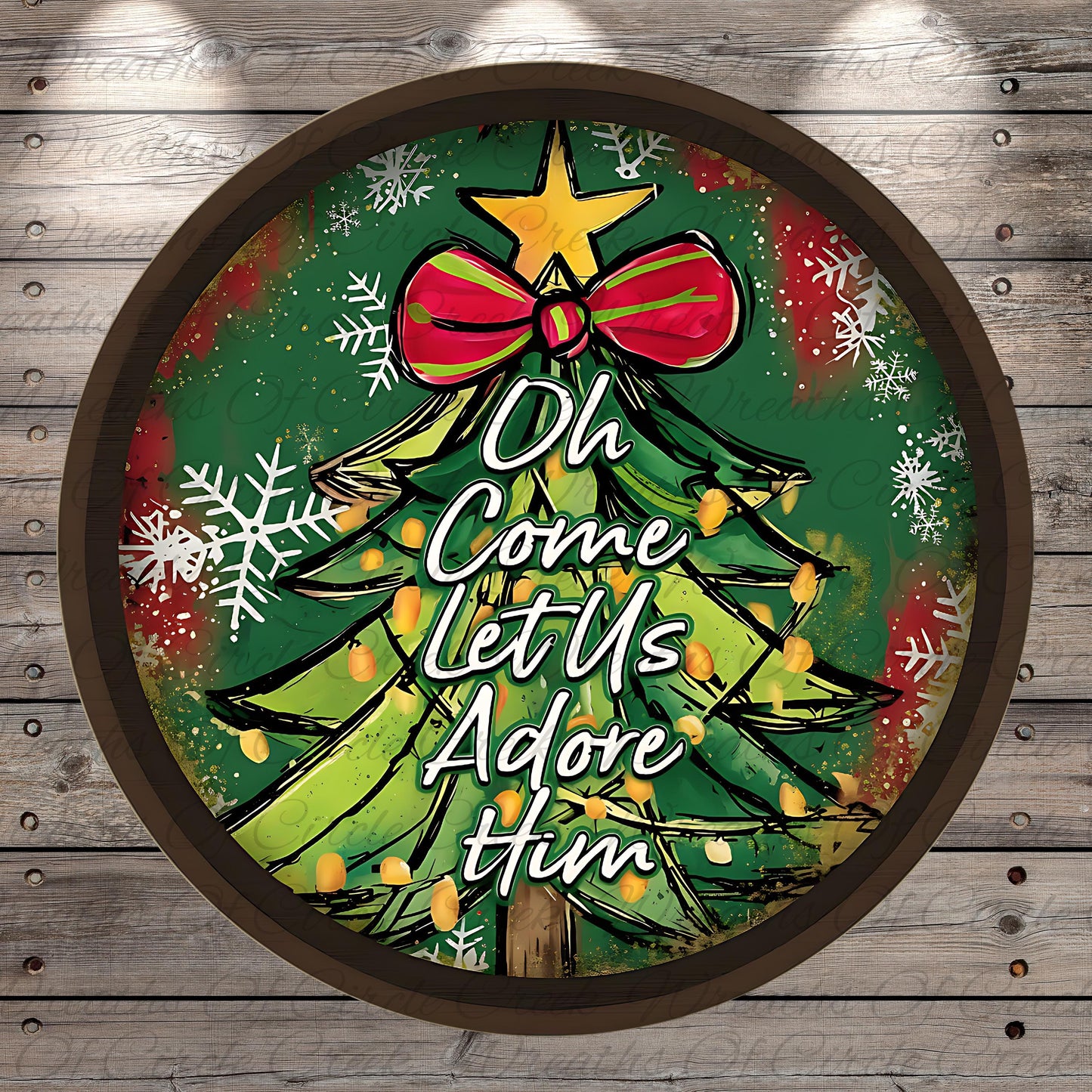 A circular Christmas tree decoration with a bow and snowflakes, surrounded by the text "Oh Come Let Us Adore Him"