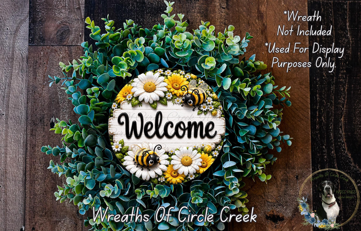 a wreath with a welcoming sign, surrounded by a lush green wreath with white and yellow flowers, and a dog in the background.