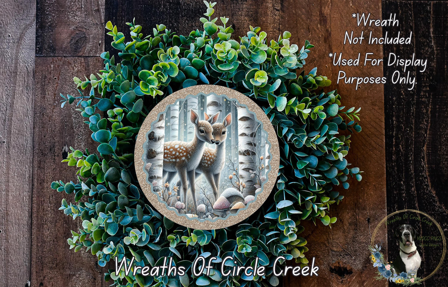 A wreath made of green foliage and a deer image, with text indicating that the wreath is not included in a display and is used for purposes only.