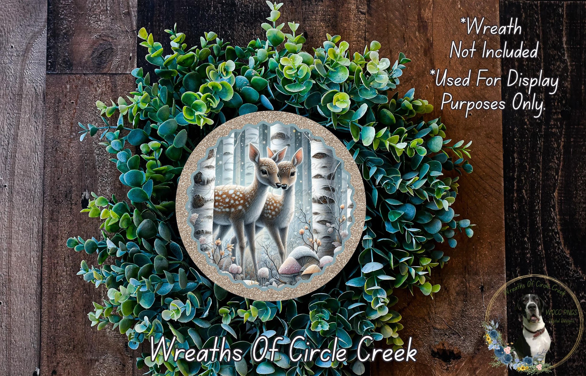 A wreath made of green foliage and a deer image, with text indicating that the wreath is not included in a display and is used for purposes only.