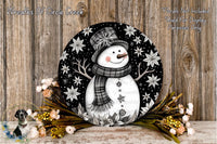 A snowman wearing a scarf and hat, surrounded by flowers and placed on a wooden surface.