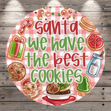 Santa Claus, cookies, a gift, a bottle, a cookie cutter, and a cookie sheet are depicted in the image.