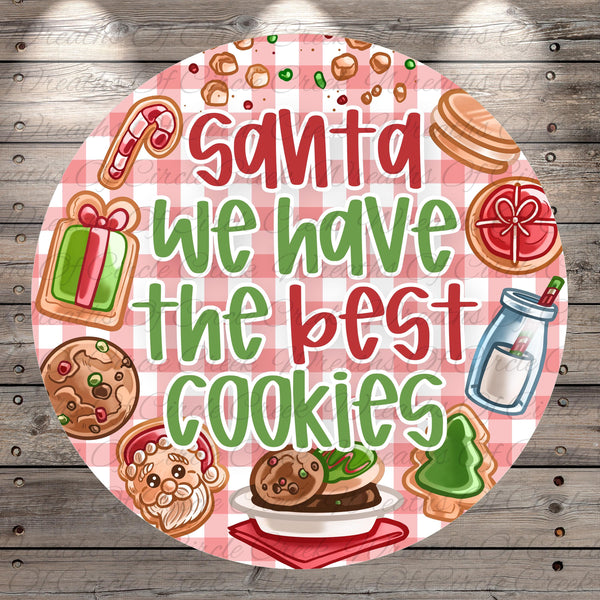 Santa Claus, cookies, a gift, a bottle, a cookie cutter, and a cookie sheet are depicted in the image.