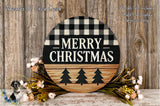 A round wooden sign with a black and white checkered pattern and the text "MERRY CHRISTMAS" in bold letters, surrounded by a floral arrangement and a small bird figurine.