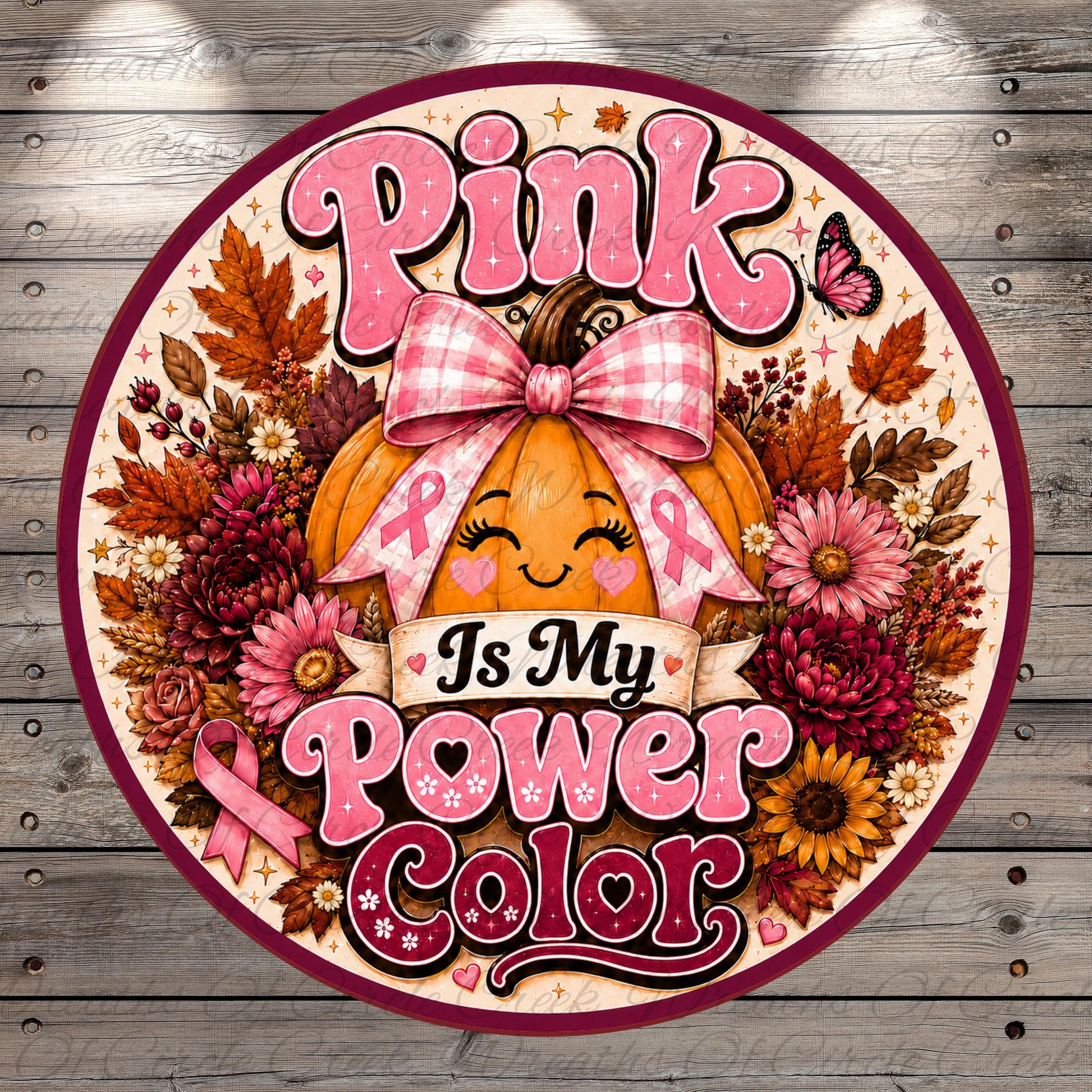 The image is a round sign with a pumpkin and flowers, surrounded by a ribbon and the text "Pink Is My Power Color".