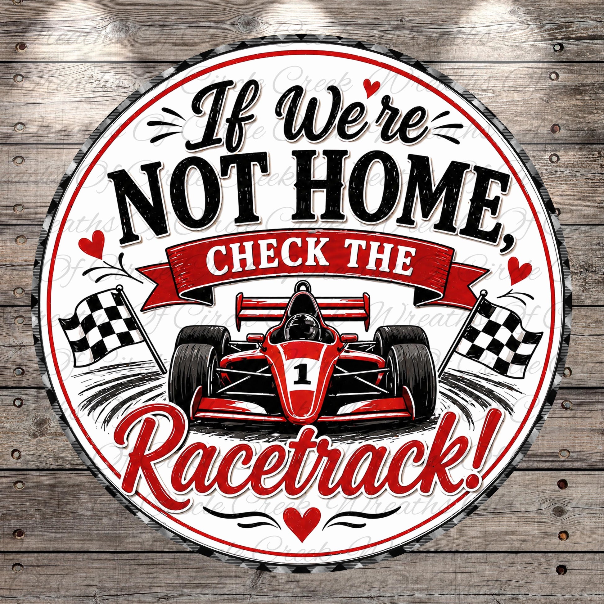 a racing car with a racing-themed design, accompanied by a humorous message that reads "If We're Not Home, Check the Racetrack!"