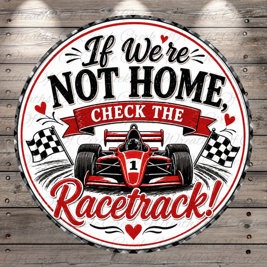a racing car with a racing-themed design, accompanied by a humorous message that reads "If We're Not Home, Check the Racetrack!"