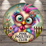 A colorful illustration of a bird with large, expressive eyes and a pink and purple feathered head, surrounded by flowers and a wooden fence.