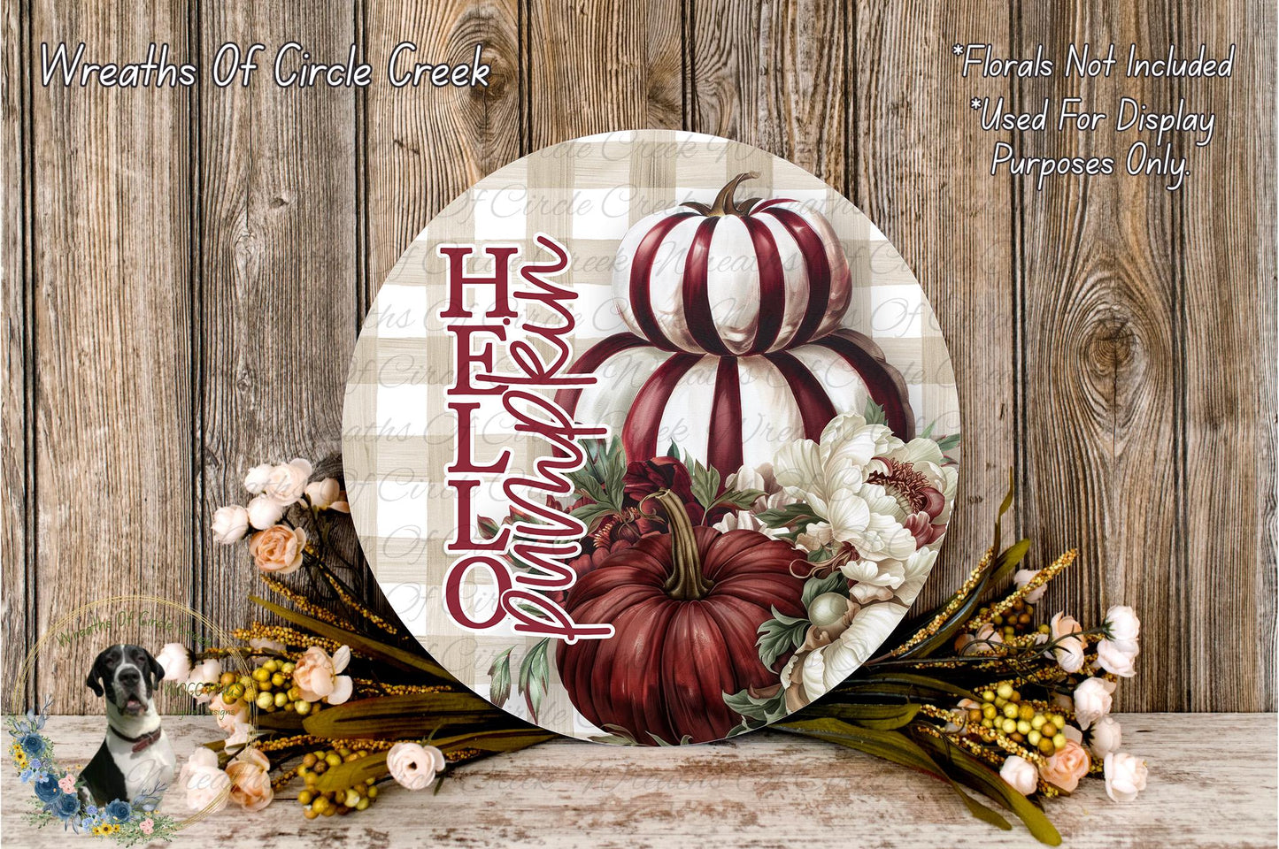a round wooden sign with a pumpkin and flowers, placed on a wooden surface. The sign has the text "HELP" written on it.