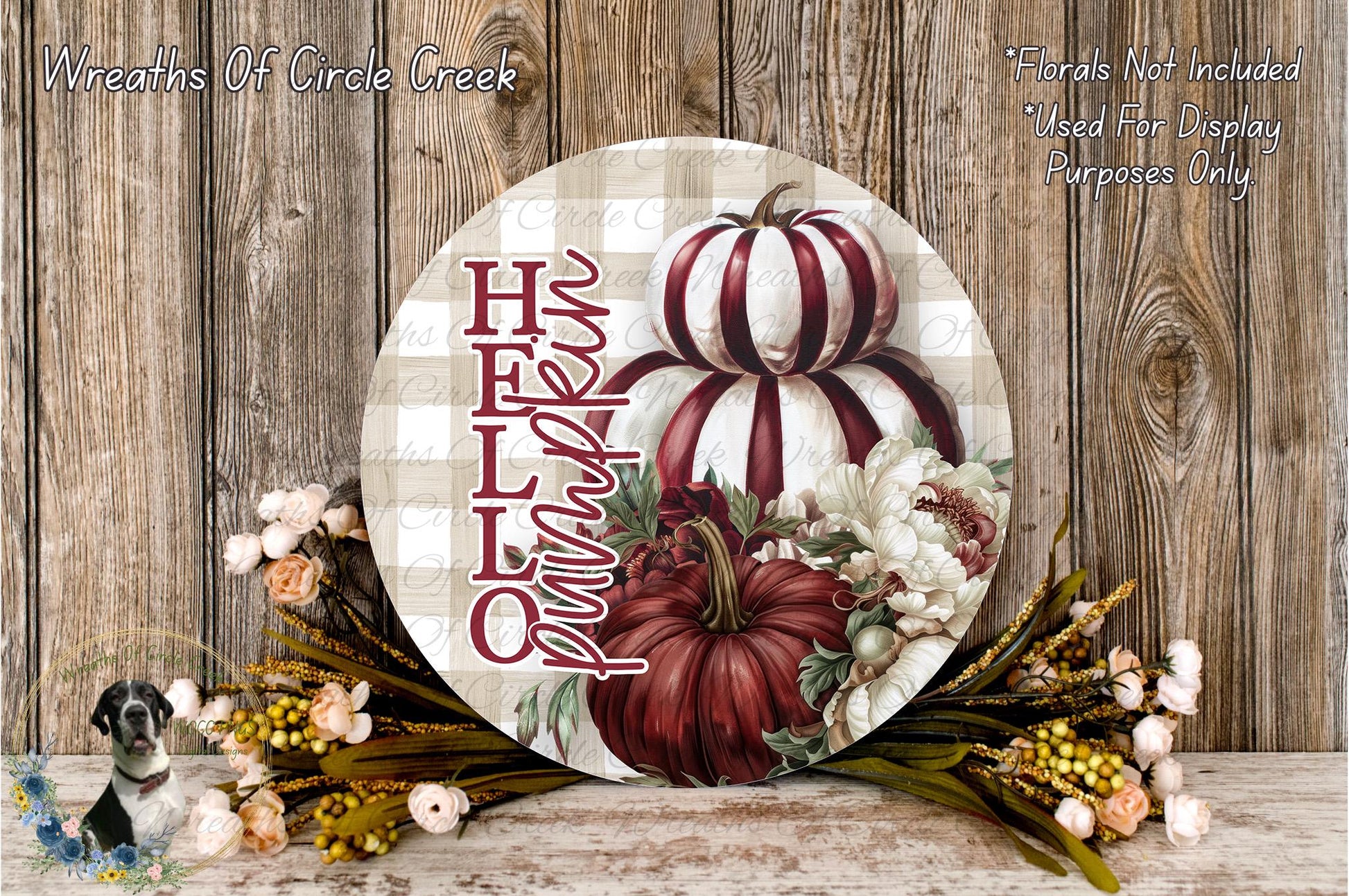 a round wooden sign with a pumpkin and flowers, placed on a wooden surface. The sign has the text "HELP" written on it.