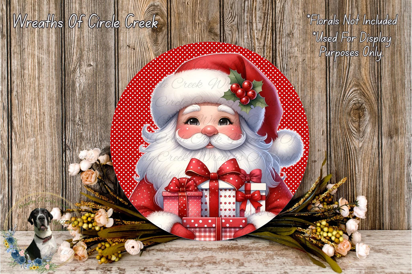 A festive Christmas-themed image featuring a large Santa Claus figure holding a gift box, surrounded by a wreath of flowers and greenery against a wooden background.