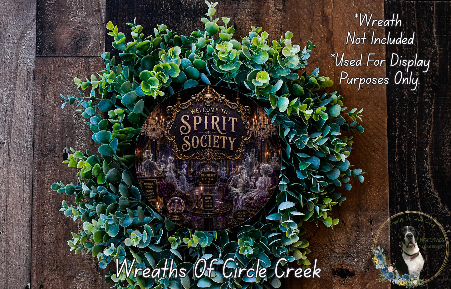 a wreath with a sign that reads "Welcome to Spirit Society", surrounded by a lush green plant. The wreath is displayed on a wooden surface, and there is a small dog in the bottom right corner of the image.