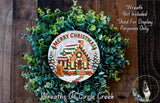 A wreath made of green leaves and a gingerbread house, with the text "Merry Christmas" and "Wreaths of Circle Creek" displayed on it.