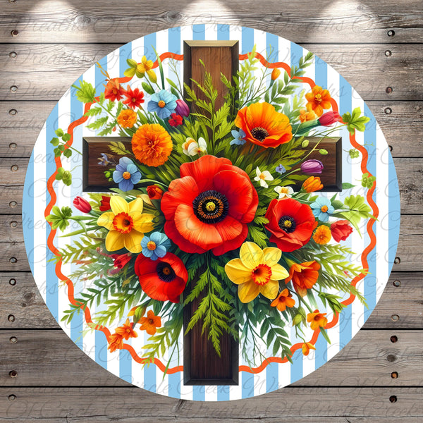 A vibrant floral arrangement with red poppies, yellow daffodils, and orange and yellow flowers is displayed on a wooden background.