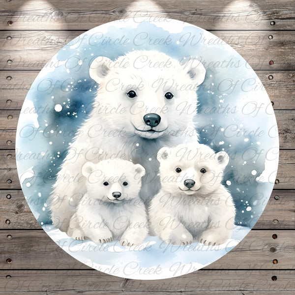 A family of three polar bears sitting together in a snowy winter scene, with a wooden background.