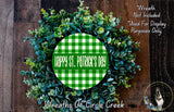 a wreath made of green and white foliage, with the text "Happy St. Patrick's Day" displayed prominently in the center.