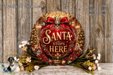 a festive Christmas-themed sign with the text "Santa stops here" displayed prominently in the center. The sign is surrounded by a wreath of Christmas trees and other holiday decorations, creating a warm and inviting atmosphere.
