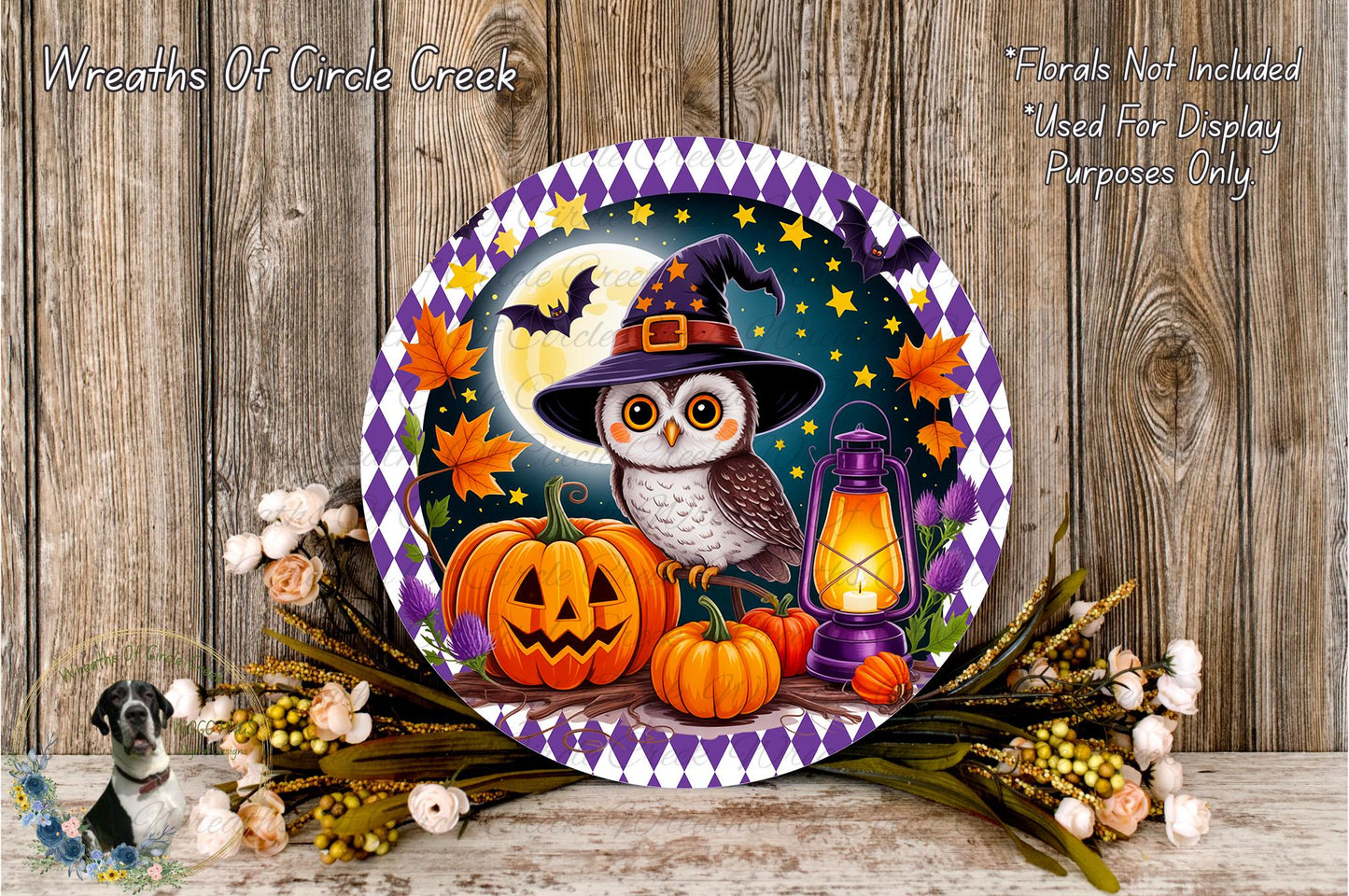 A Halloween-themed wreath featuring an owl wearing a witch's hat, surrounded by pumpkins, a lantern, and autumn leaves, set against a night sky background.