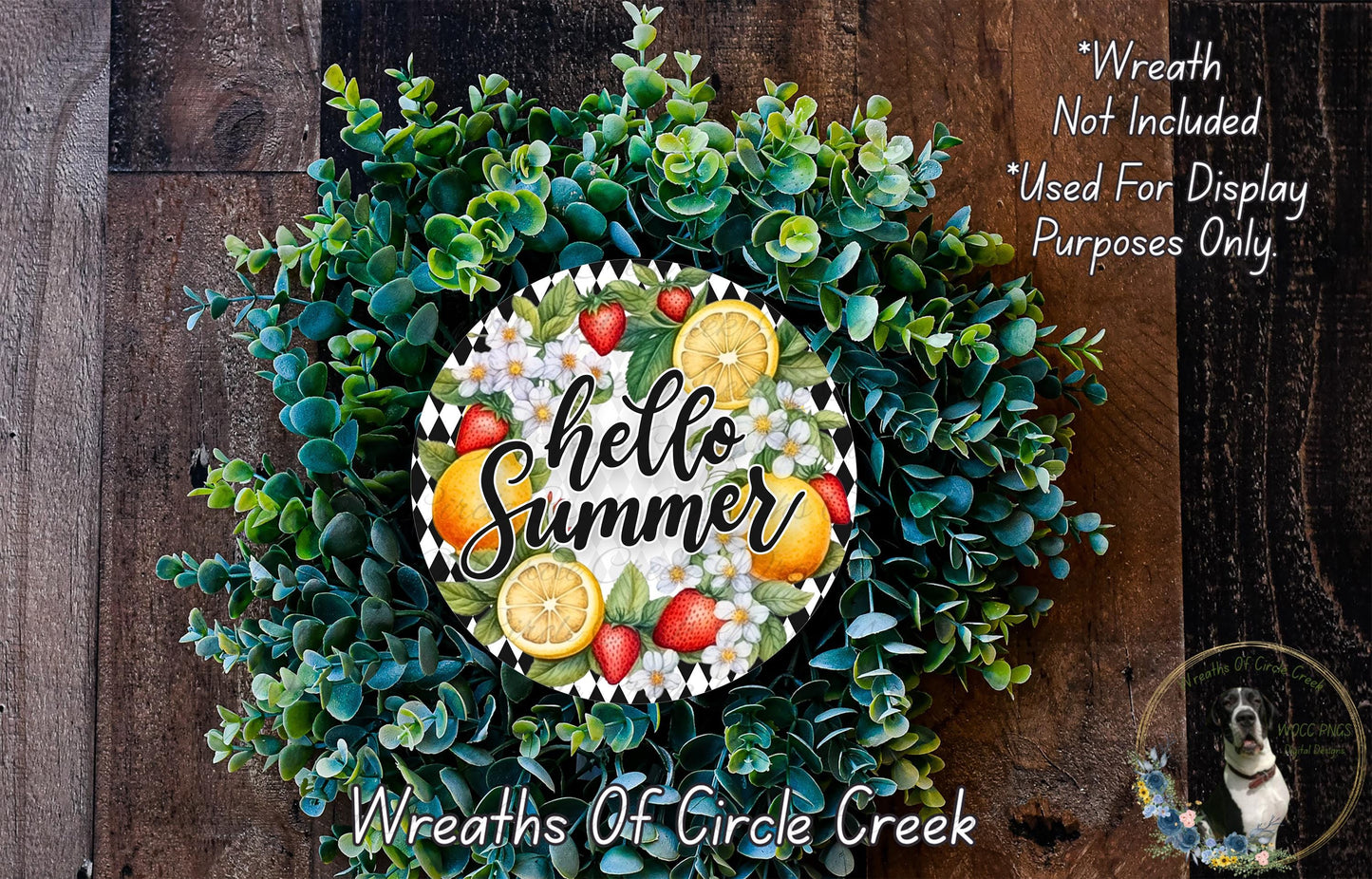A wreath made of various green plants and fruits, including oranges, strawberries, and lemons, with the text "Hello Summer" displayed on it.