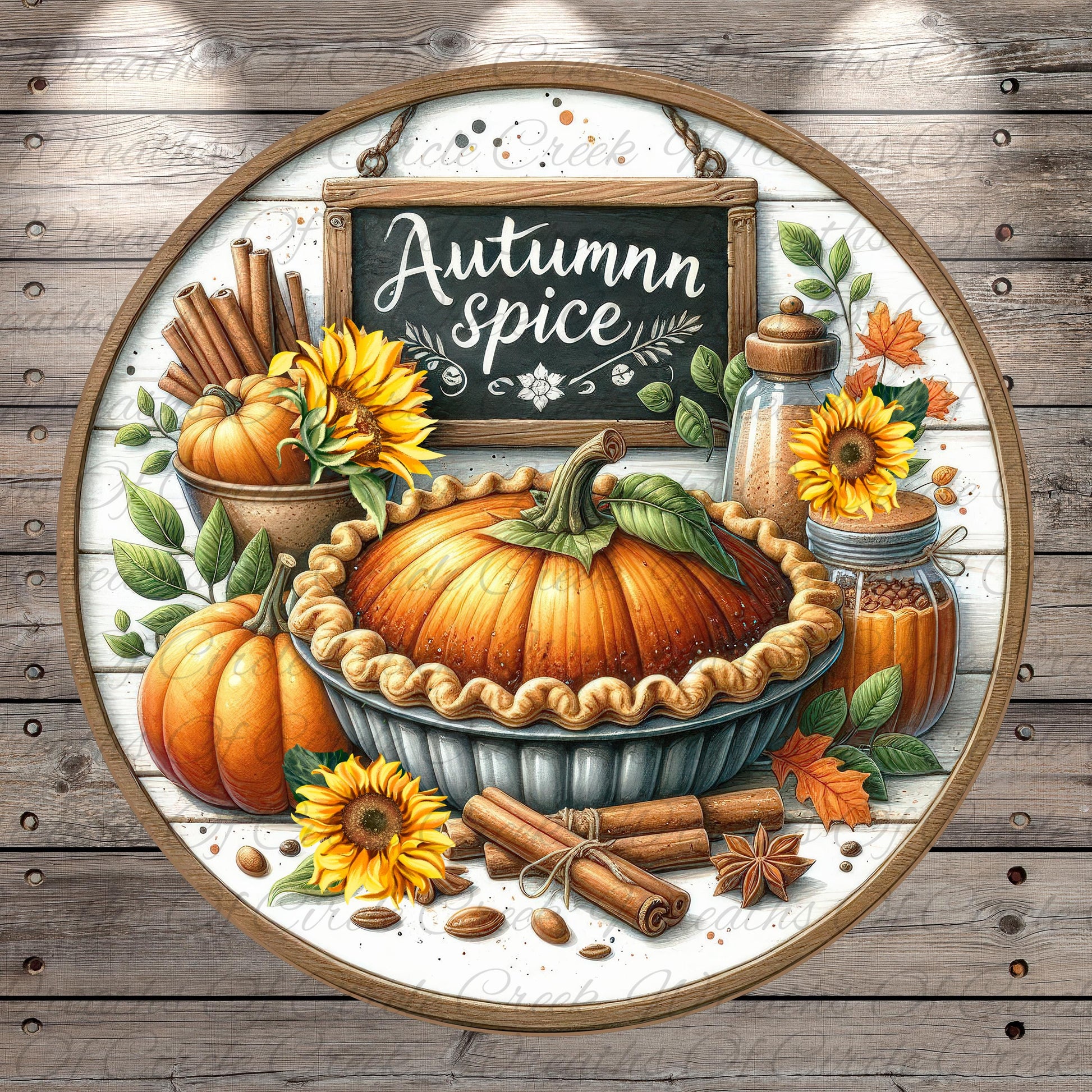 The image is a decorative arrangement featuring a pumpkin pie surrounded by autumn-themed elements such as sunflowers, cinnamon sticks, and a chalkboard sign that reads "Autumn spice".