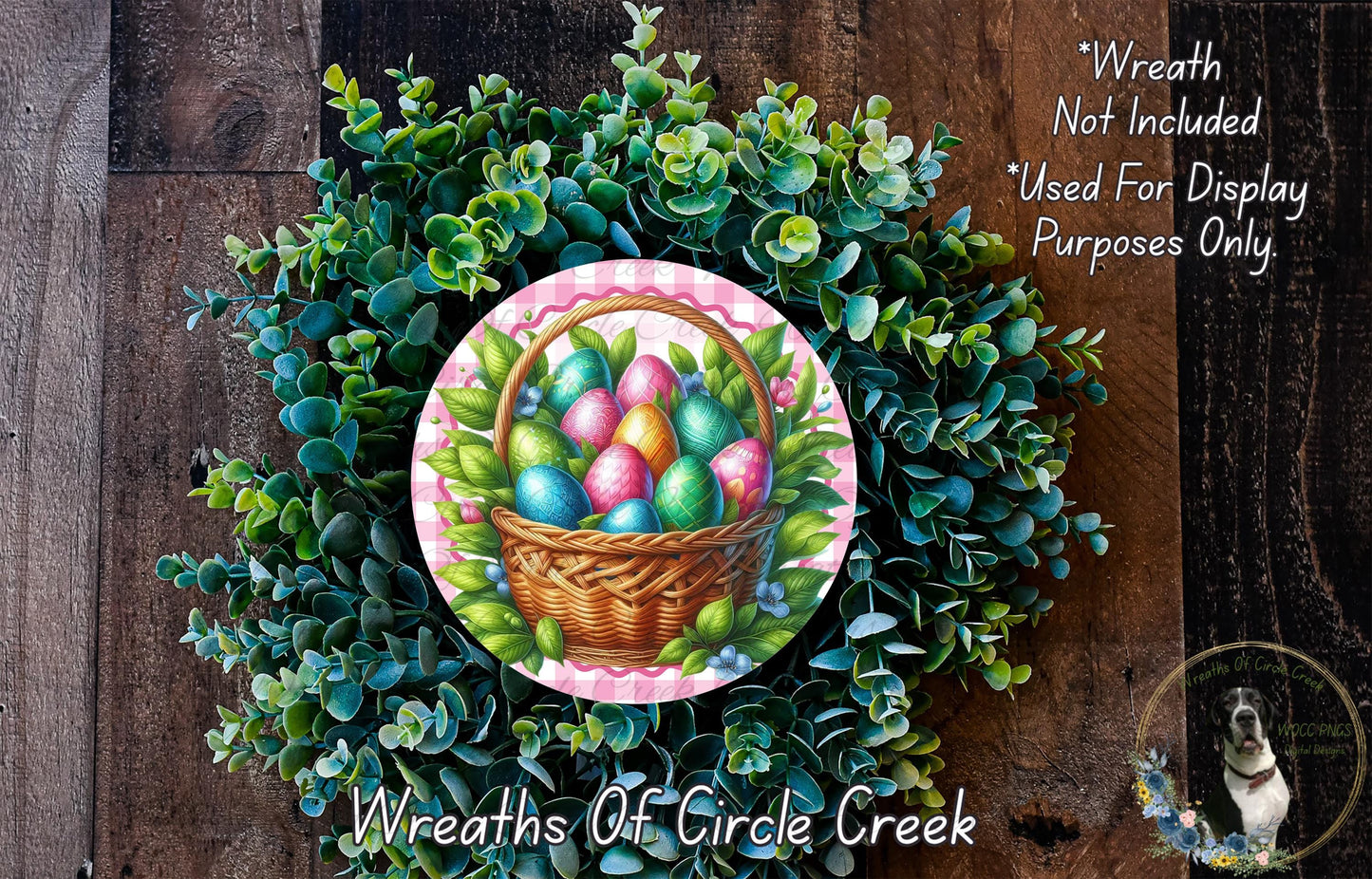 a wreath made of green leaves and a basket filled with colorful Easter eggs, set against a wooden background.