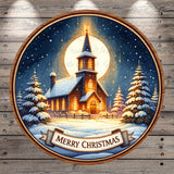 A circular Christmas-themed illustration depicting a church with a glowing cross, surrounded by snow-covered trees and a full moon, with the text "Merry Christmas" at the bottom.