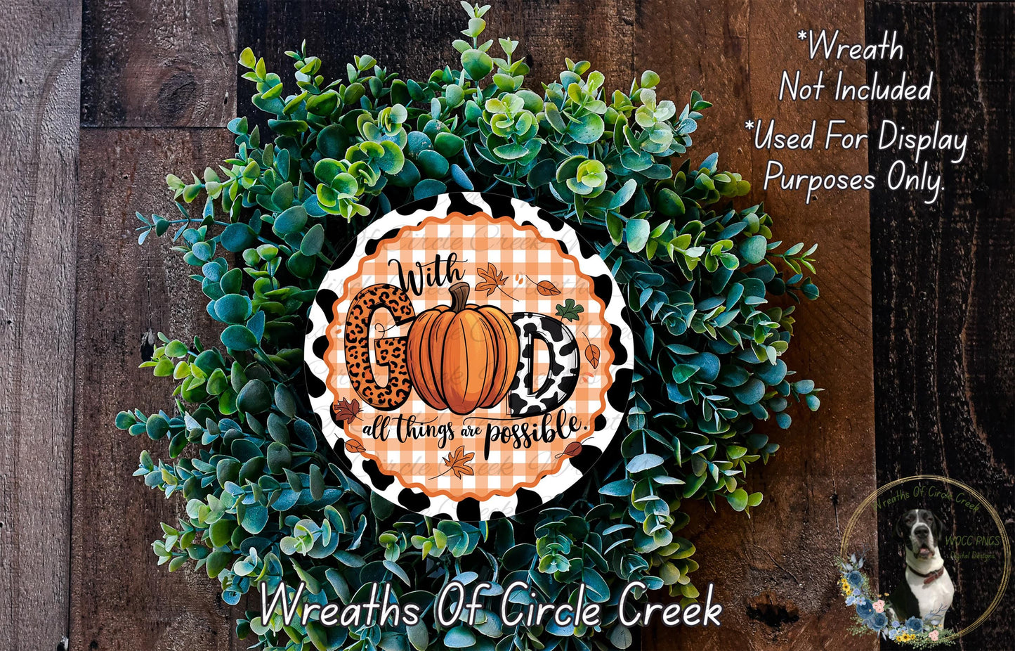 A wreath made of green leaves and a pumpkin, with a decorative sign that says "With God all things are possible".