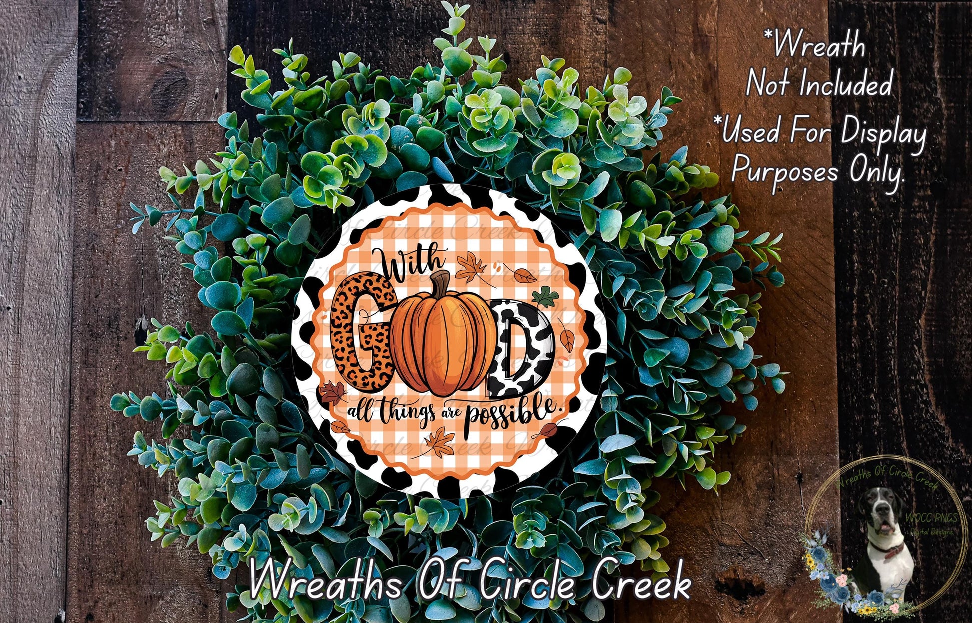 A wreath made of green leaves and a pumpkin, with a decorative sign that says "With God all things are possible".