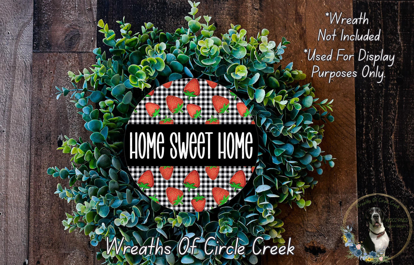 a wreath made of green leaves and red berries, with the text "Home Sweet Home" displayed prominently in the center.