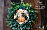 a wreath made of various fall-themed elements, including pumpkins, greenery, and a black and white checkered border. The wreath is displayed on a wooden surface, and there is a small dog visible in the bottom right corner of the image.